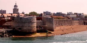 The entrance to Portsmouth Harbour in England. Harbour defences are in the foreground.
