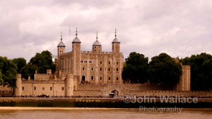 The beauty of historical workmanship of the Tower of London UK as seen across the river Thames